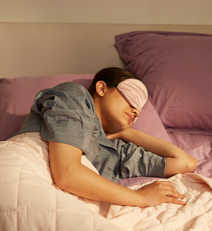 Women taking good sleep with weighted Blanket: The sleep chapter